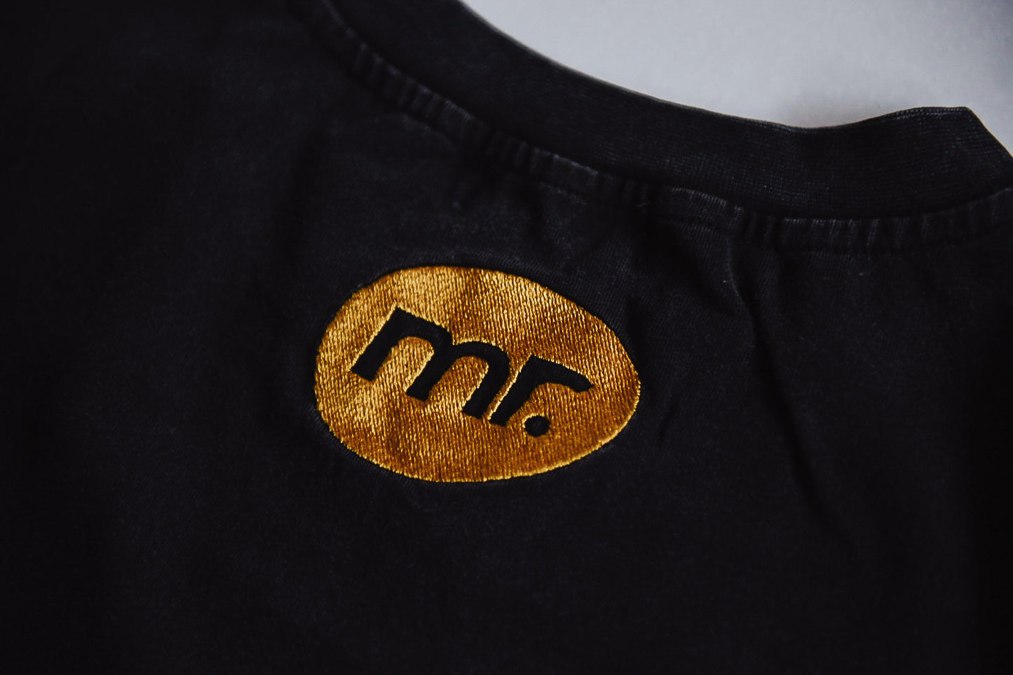 Tee Acid Black with Blue & Yellow logo